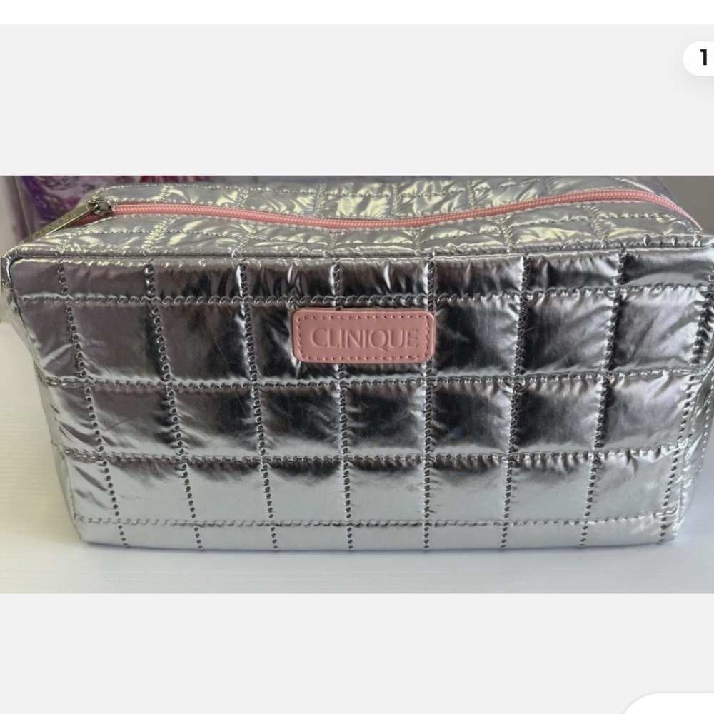 Silver and pink Clinique makeup bag